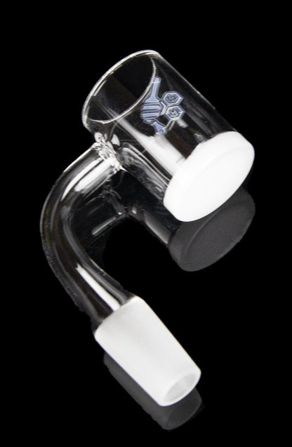 Clear glass dab rig with a bent neck and white accents, isolated on a black background.