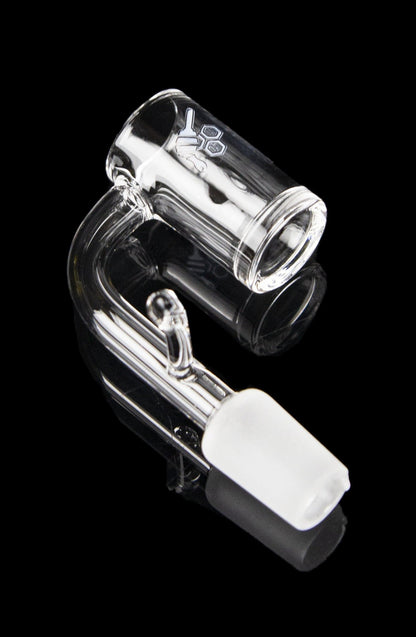 Clear glass dab rig with a quartz insert, isolated on a black background.