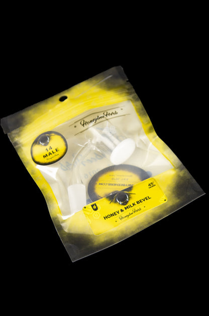 Yellow mylar bag containing a glass cannabis pipe with "Honeybee Herbs" branding.