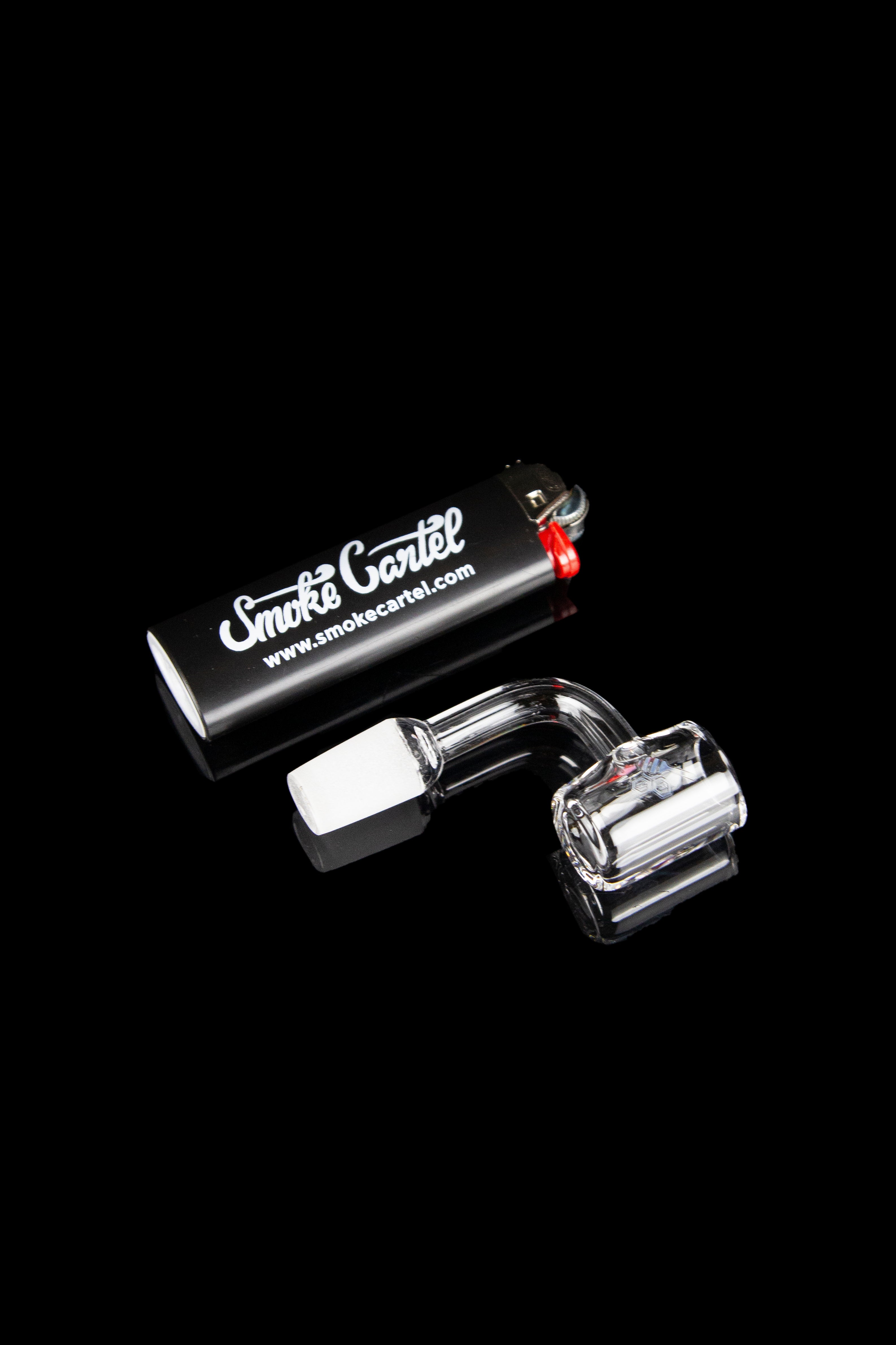 Glass dab rig with accessories and branding for Smoke Cartel.