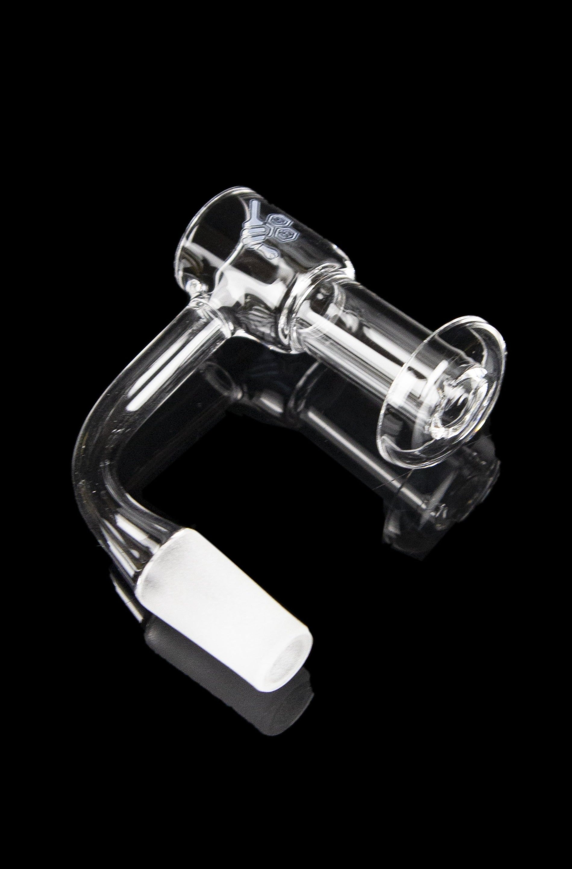 Clear quartz dab rig with black accent and carb cap, isolated on a black background.