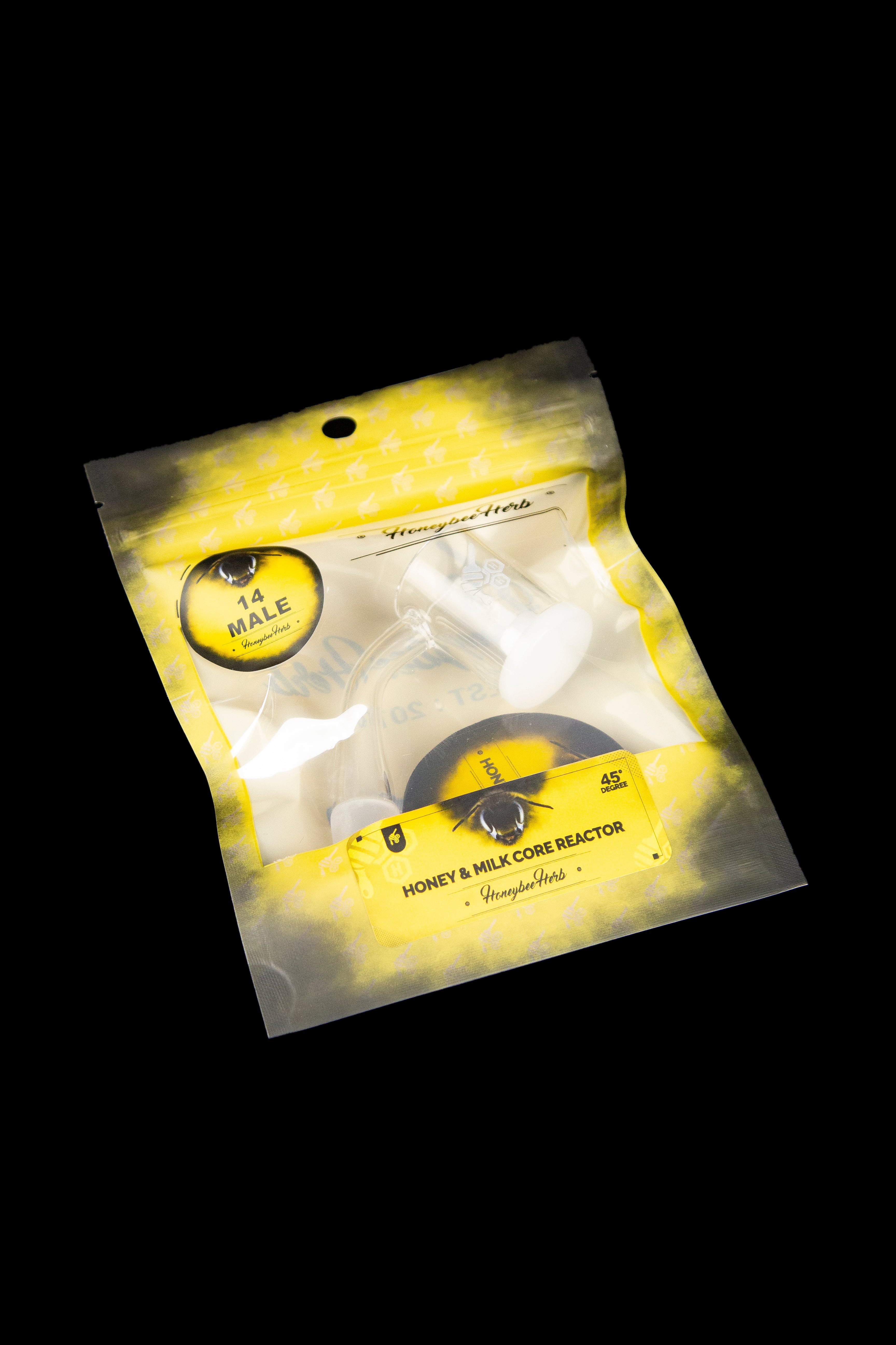 A sealed yellow pouch containing a cannabis concentrate reactor, labeled "Honey & Milk Core Reactor" and "45 90%" with a "14 Male" sticker.
