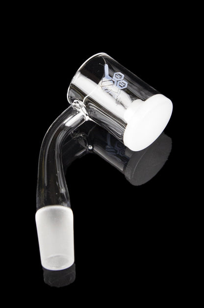 Clear glass dab rig with white accents, isolated on a black background.