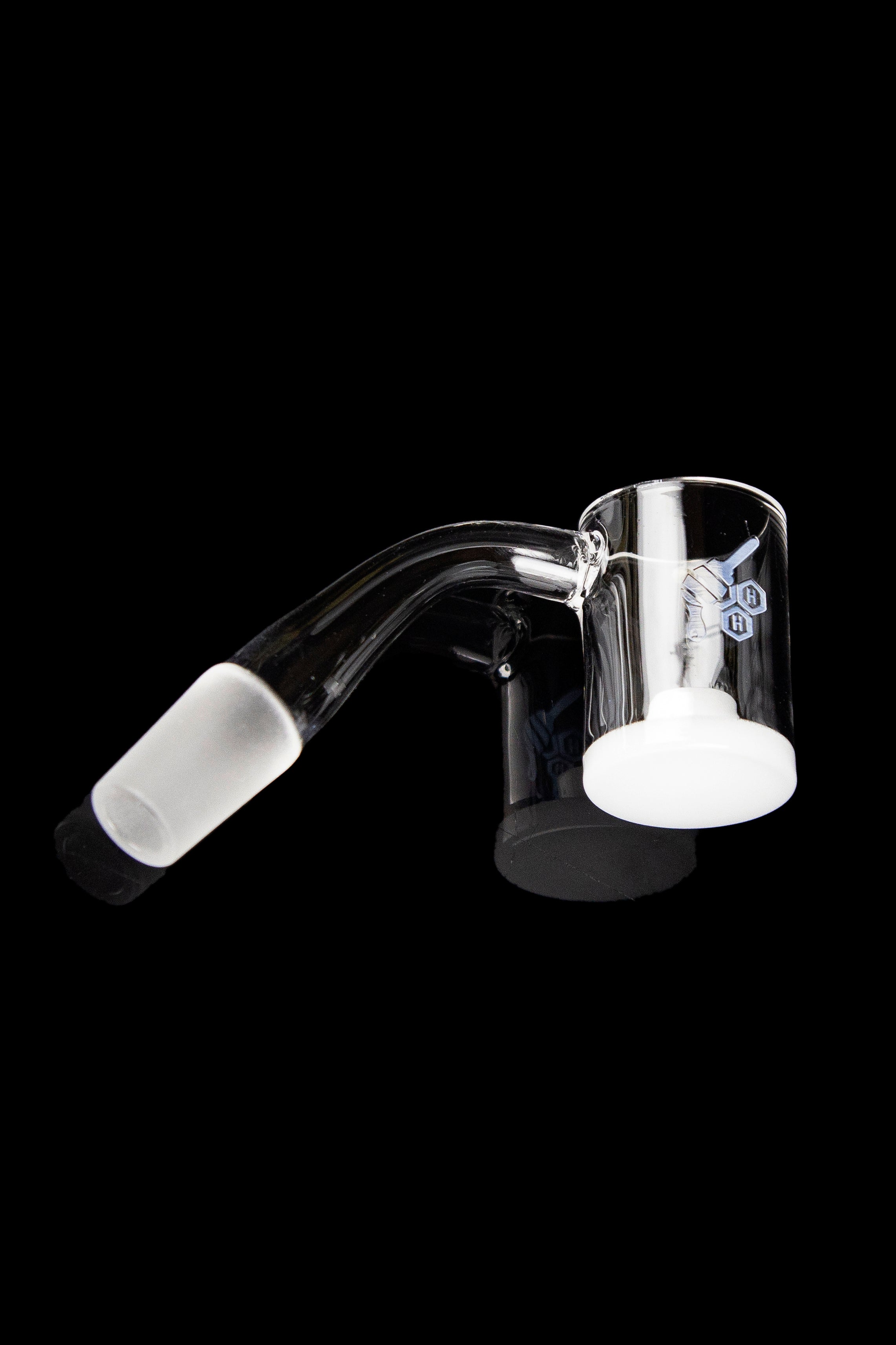 Clear glass dab rig with angled mouthpiece and quartz insert.