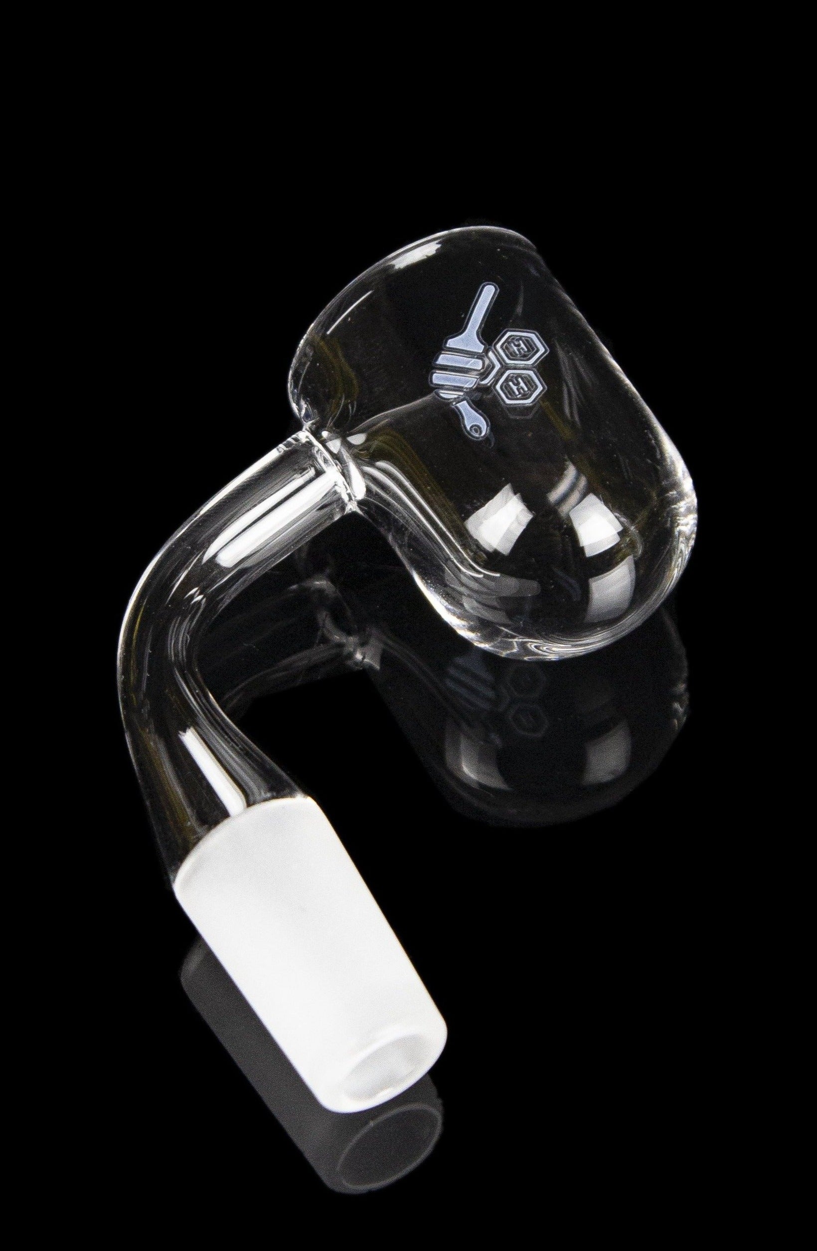 Clear quartz dab rig insert with etched design, against a black background.