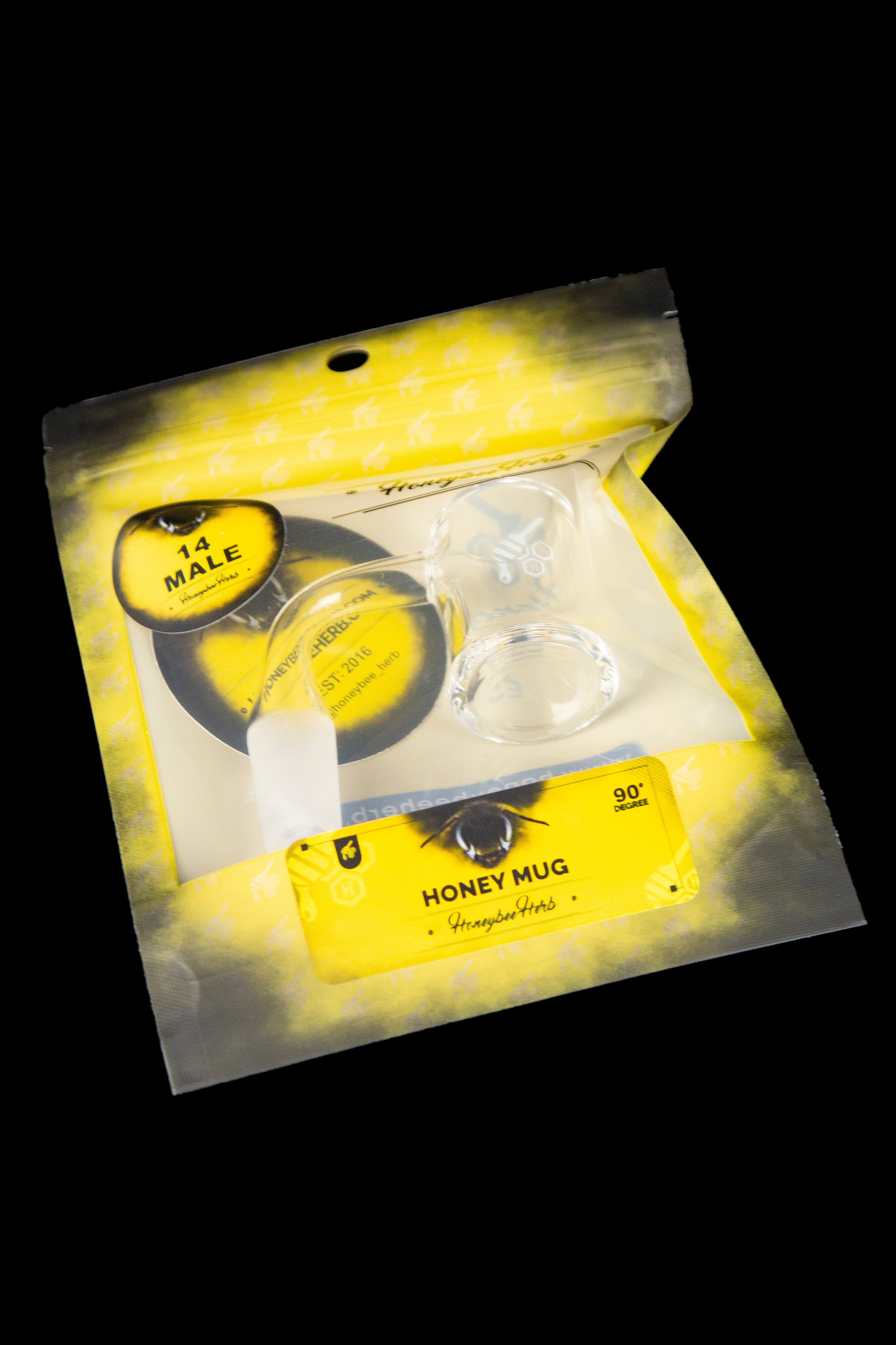 Product packaging for “Honey Mug” cannabis accessory, featuring a glass smoking piece and yellow branding.