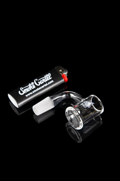 Glass bowl and metal case with “Smoke Cartel” branding on a reflective black surface.