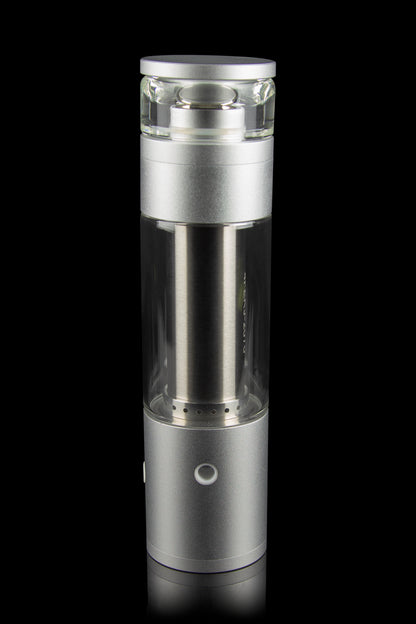Sleek silver cannabis oil rig with a glass bubbler chamber, displayed against a black background.