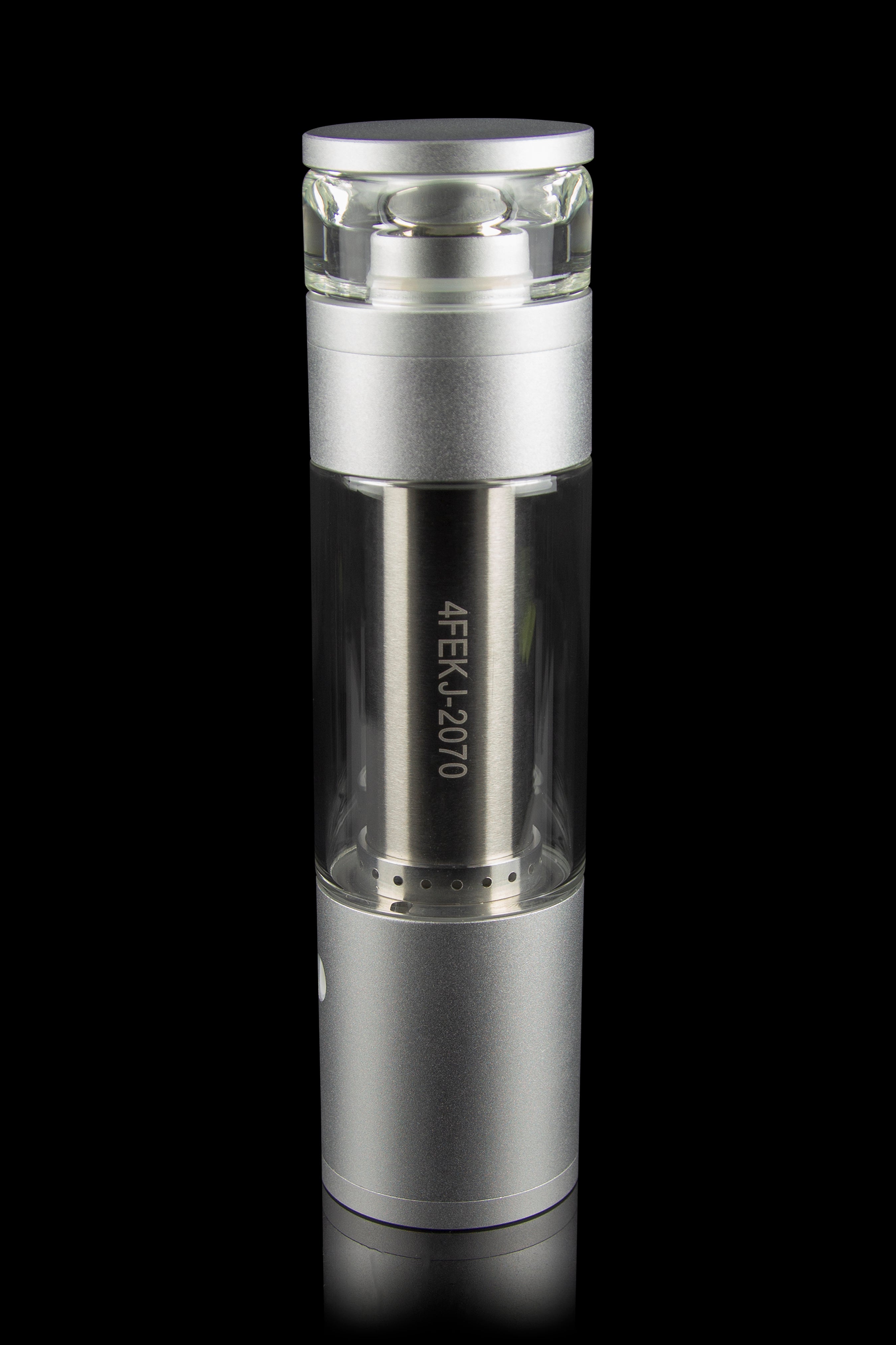 Silver cannabis oil vape pen with a glass mouthpiece and engraved serial number, isolated on black.