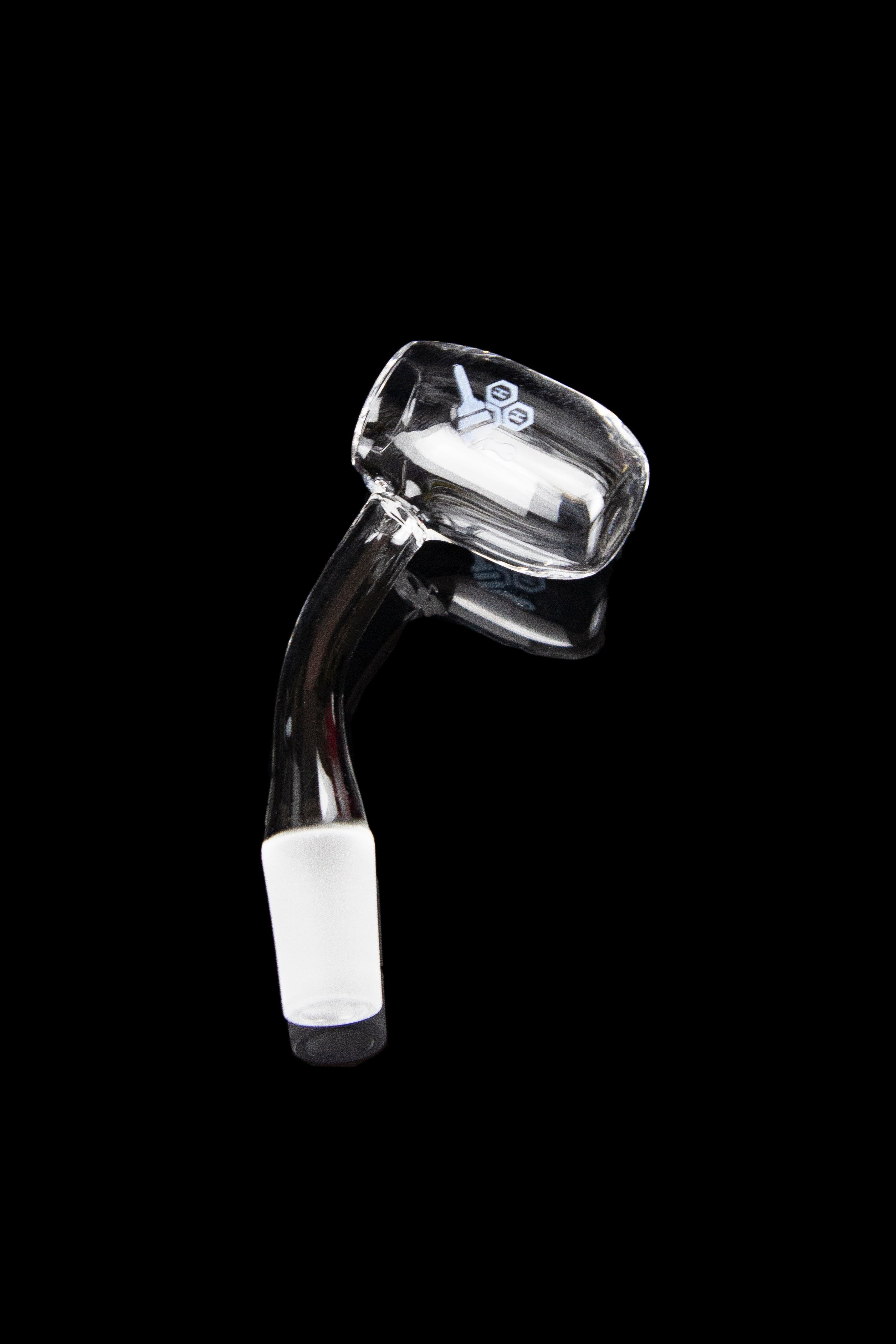Clear glass dab nail with a bent neck and angled bowl, isolated on a black background.