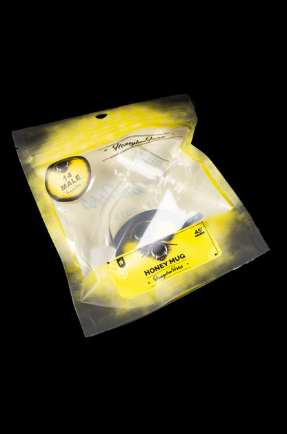 Yellow mylar bag labeled “Honey Mug” with a bee illustration, containing a cannabis smoking device.