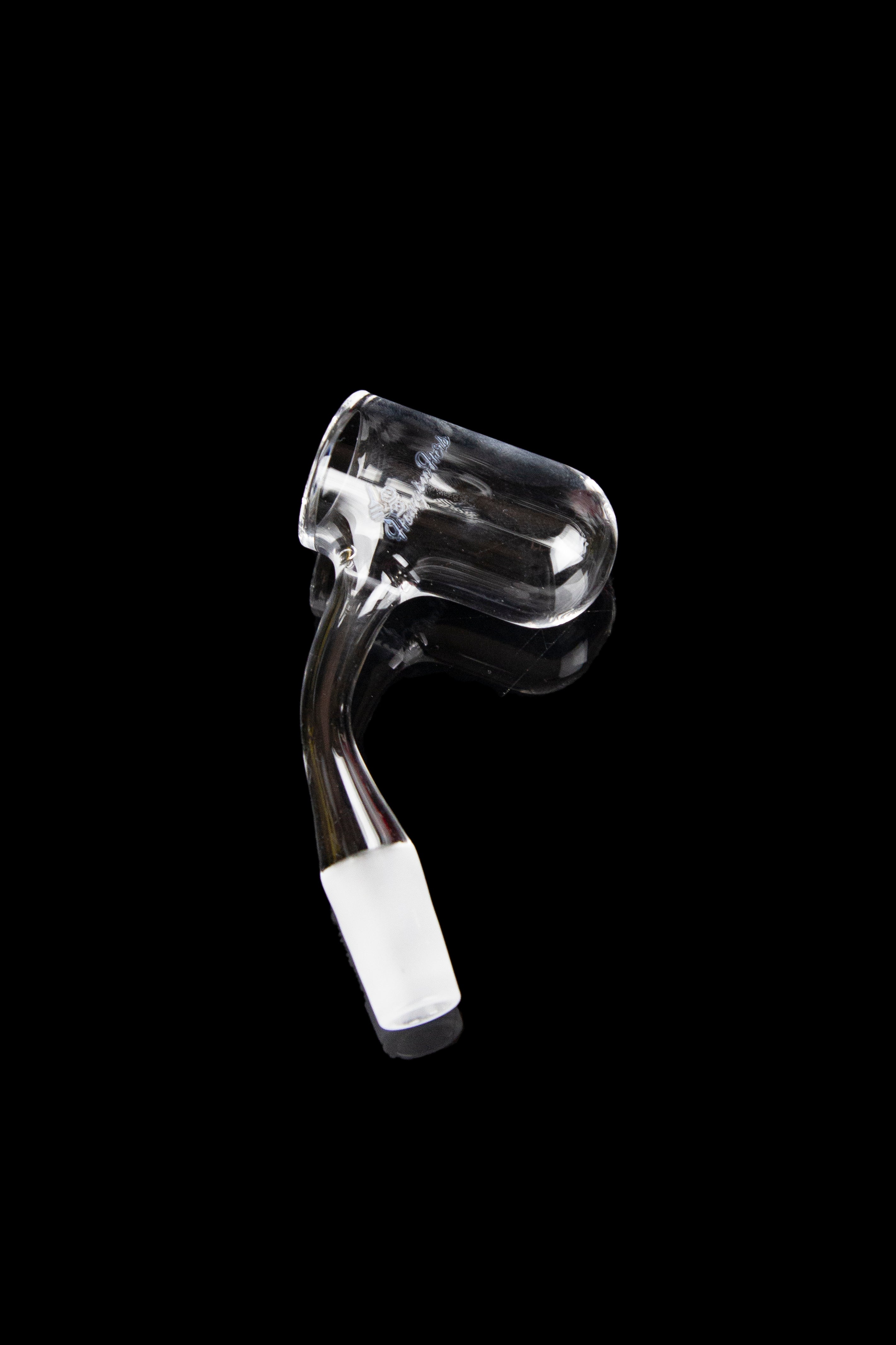 Clear glass dab rig insert against a black background.