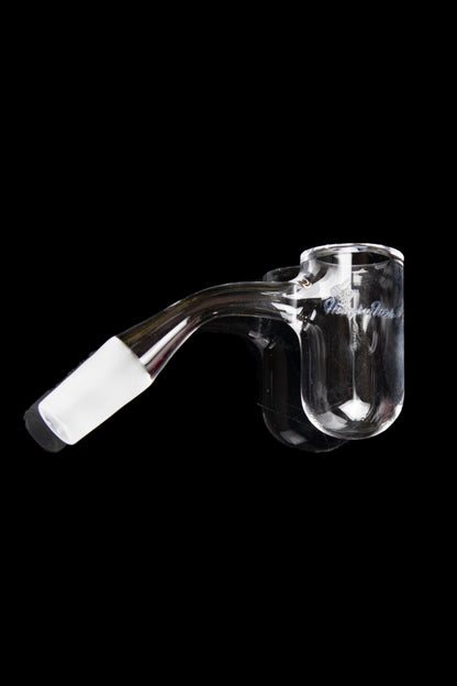 Clear glass dab rig with a visible bowl and mouthpiece, isolated on a black background.