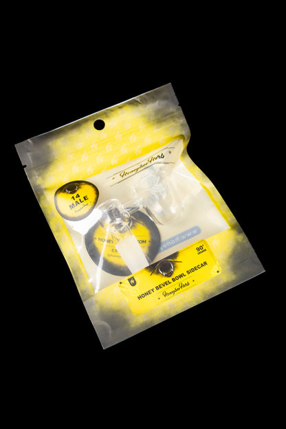 A sealed, metallic gold pouch displaying a black glass cannabis bowl accessory called “Honey Bevel Sidecar” with a 90-degree angle. 