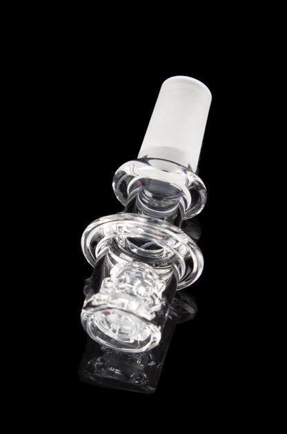 Clear glass cannabis oil rig bubbler with intricate sculpted design.