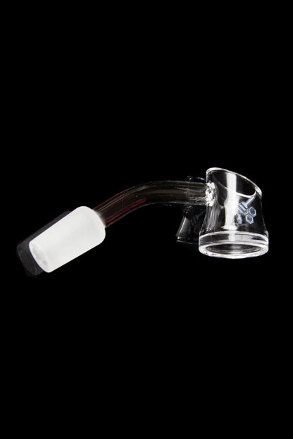 Clear quartz dab rig with a white carb cap, isolated on a black background.