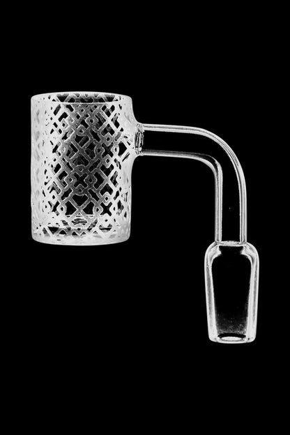 A close-up, angled view of the Interlocking Diamonds Etched Quartz Banger, showing its detailed, textured glass design.