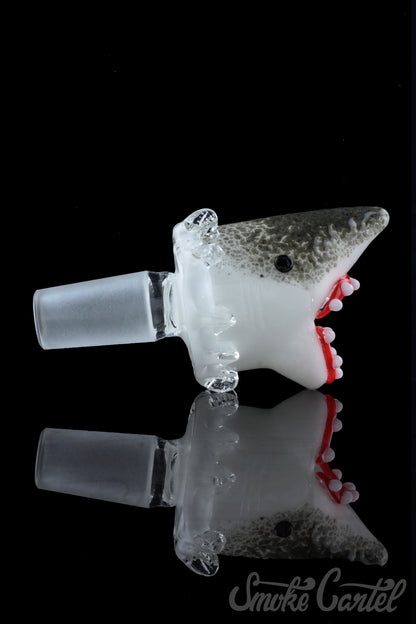 The Empire Glassworks "Jawsome" Bowl Piece is pictured from a low angle against a black background, showcasing its shark-themed design.
