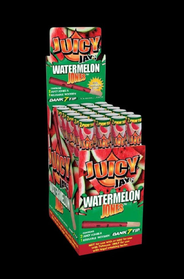 A stack of unopened **Juicy Jays Pre-Rolled Cones - 24 Pack** displays the brand's watermelon design in a bright, angled studio shot.