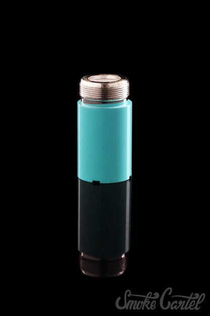 A close-up, angled view of the Kandy Pens Donut Replacement Coil against a black background, showcasing its metallic finish.