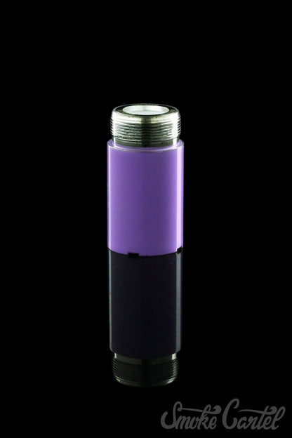 A studio shot of the Kandy Pens Donut Replacement Coil, shown as a silver and purple component against a dark reflective surface.