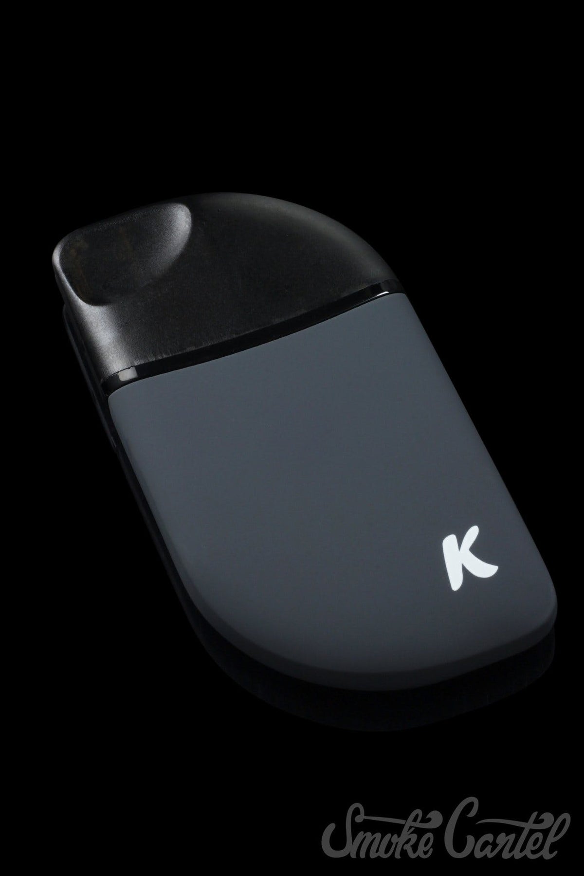 A sleek, angled studio shot of the Kandy Pens Feather Compact Vaporizer, showcasing its minimalist design on a dark background.