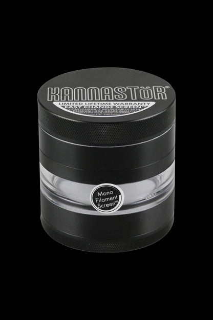 A close-up, angled view of the Kannastor 2.5" 4-Piece Grinder, showcasing its metallic finish and circular design.