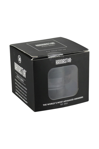 A close-up, angled view of the Kannastor 2.5" 4-Piece Grinder with Monofilament EZ Screen, showcasing its metallic finish and multi-part design.