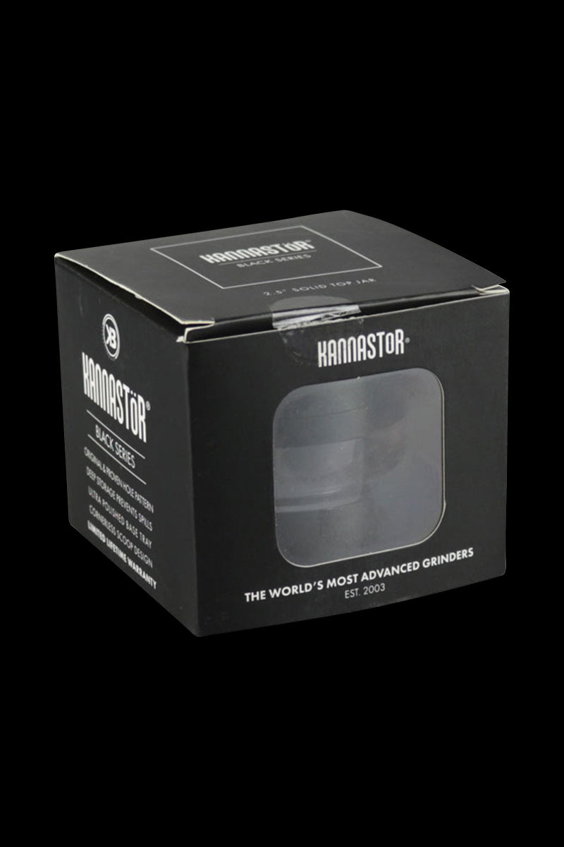 A centered, close-up view of the Kannastor 2.5" 4-Piece Grinder, showcasing its black metallic finish and stacked components.