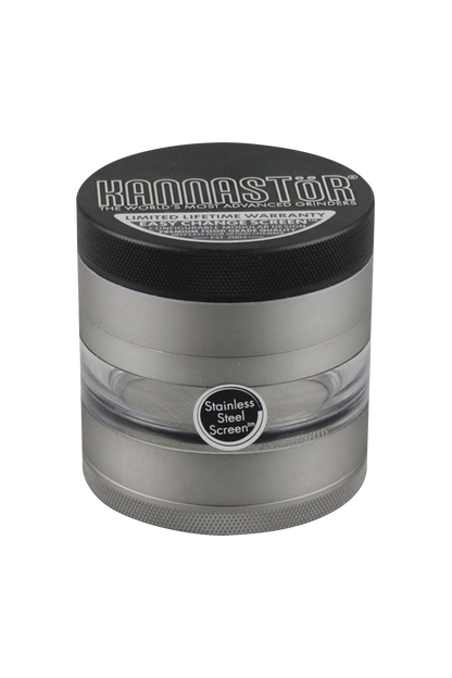 A close-up of the gunmetal Kannastor Multi Chamber Grinder, showcasing its multi-tiered design and circular shape.
