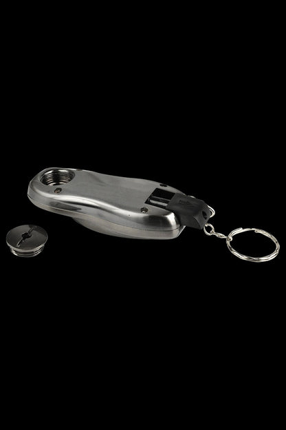 A slightly angled close-up of the Stealth "Car Key Fob" Secret Hand Pipe, showing its metallic finish and key-chain attachment.
