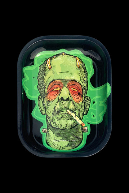 A close-up, overhead view of the “Kill Your Culture “Frankenstoned” Rolling Tray” depicts a Frankenstein-inspired design with vibrant green accents.