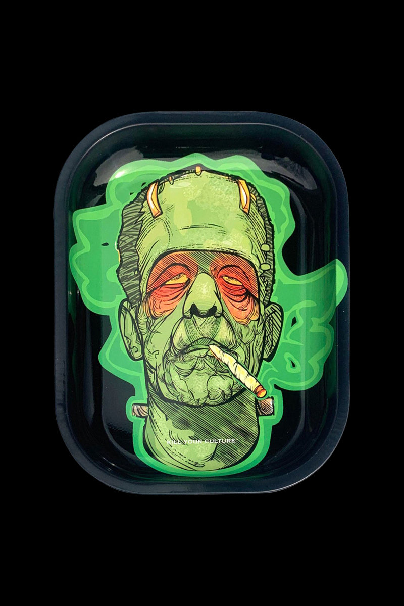 A close-up, overhead view of the “Kill Your Culture “Frankenstoned” Rolling Tray” depicts a Frankenstein-inspired design with vibrant green accents.