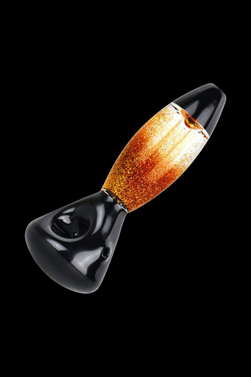 Glass pipe with glitter-filled bulb, black background.