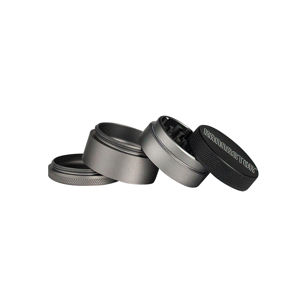 A close-up, angled view of the Kannastor 4-Piece Solid Body Grinder, showcasing its metallic finish and multi-part construction.