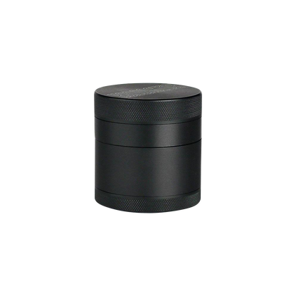 A studio shot of the Kannastor 4-Piece Solid Body Grinder, showcasing its dark metal exterior and four-piece construction.