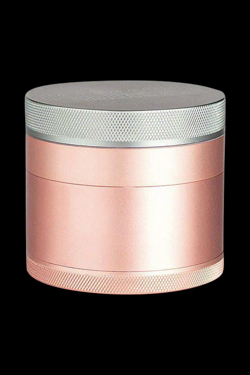 Front view of the Kannastor 4-Piece Solid Body Grinder, showcasing its metallic finish and cylindrical shape.