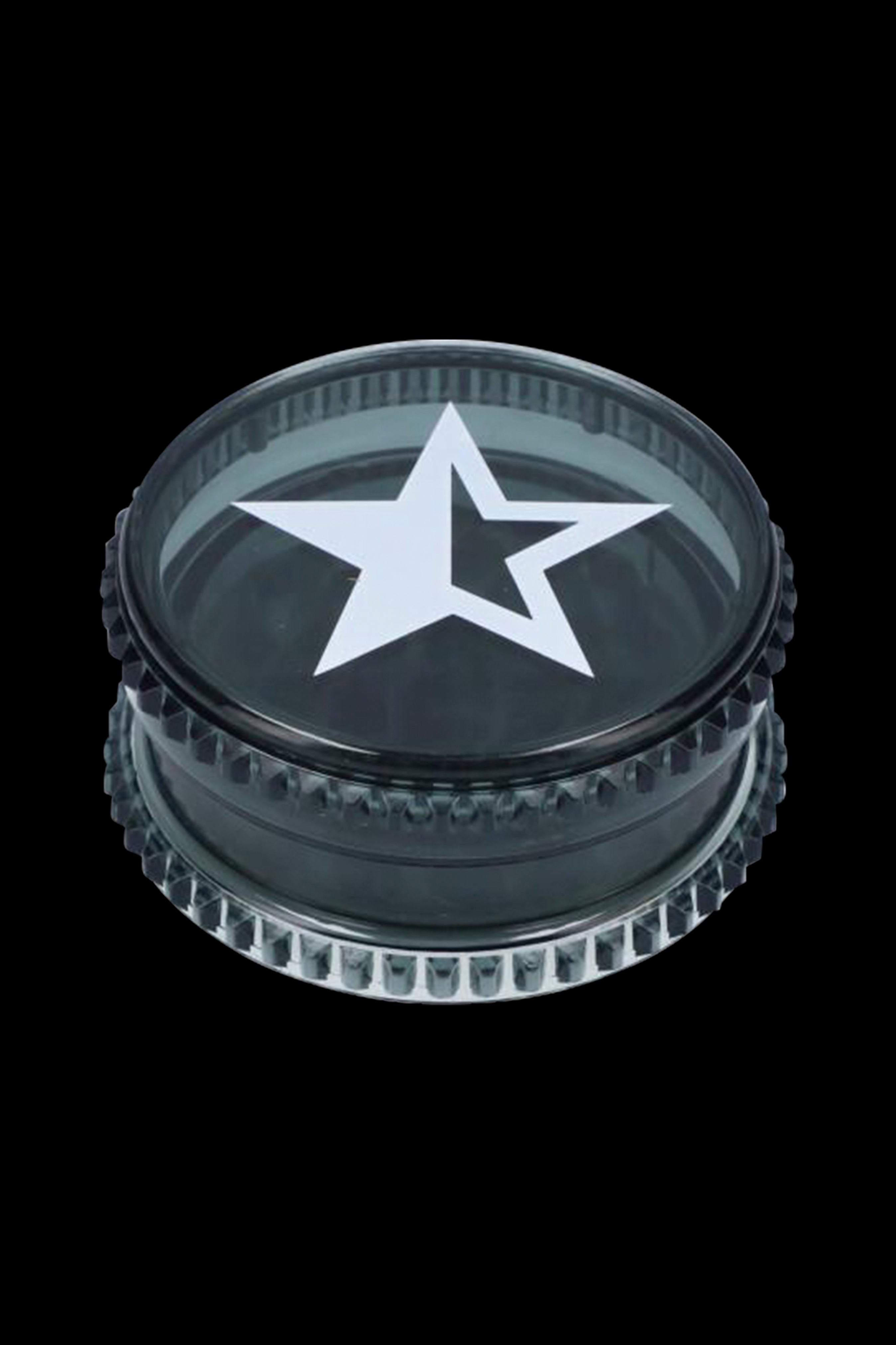 Black metal grinder with a white five-pointed star emblem.