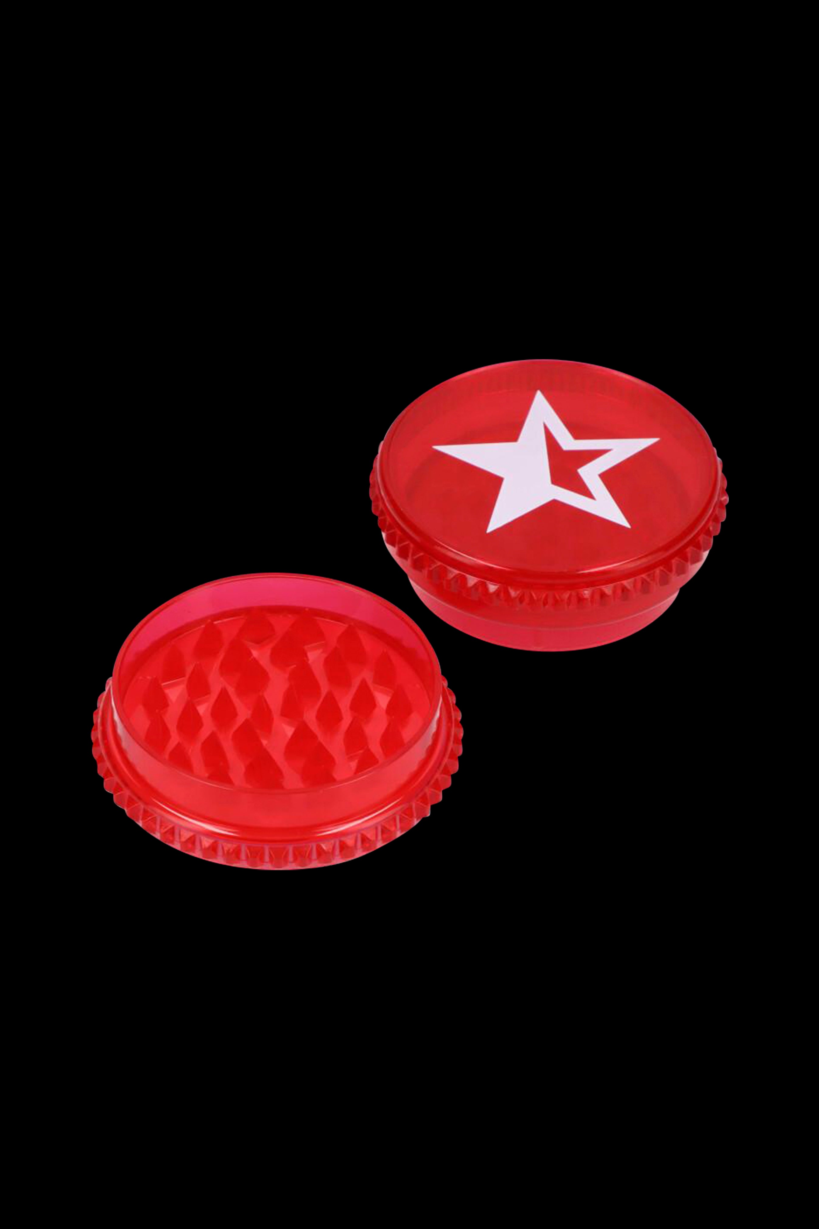 Red grinder with a white star emblem, and its open grinding side visible.