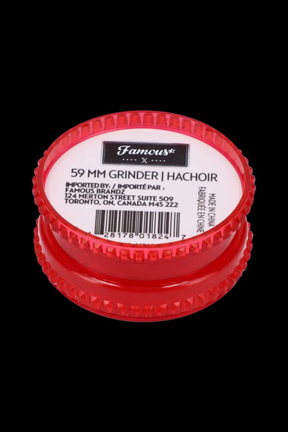 Red cannabis grinder with product details and barcode.