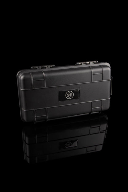 Black, airtight case with a stylized atom logo, stacked on a reflective surface, likely for cannabis storage.