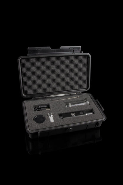 Open black case containing a cannabis oil vaporizer pen and accessories, lined with foam insert.