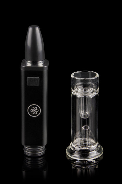 Black cannabis e-rig pen with a clear glass insert, studio shot on a reflective surface.