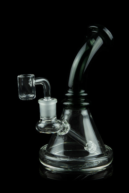 Glass dab rig with quartz banger, isolated on a black background.