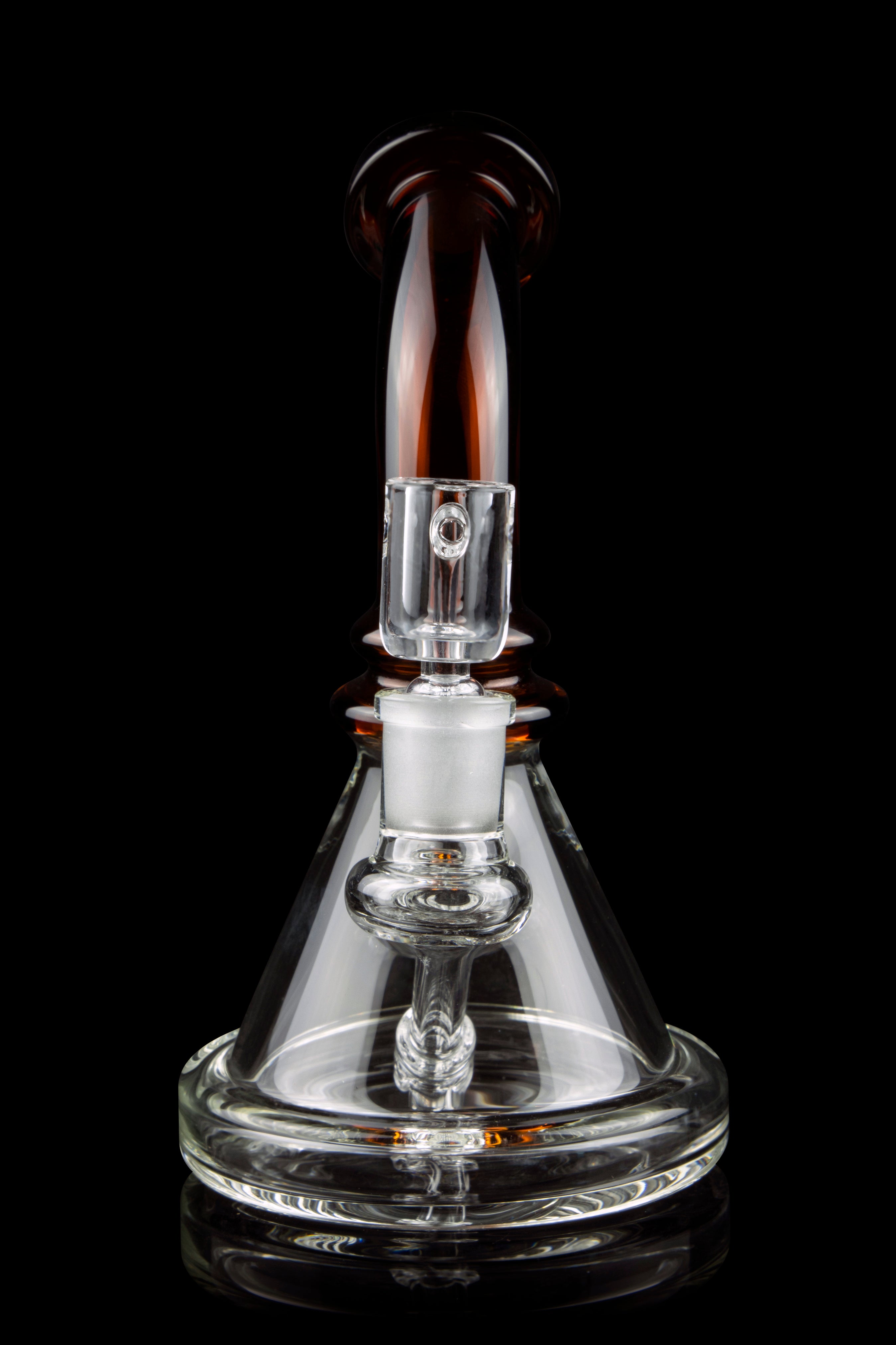 Clear glass dab rig with amber accents, isolated on a black background.