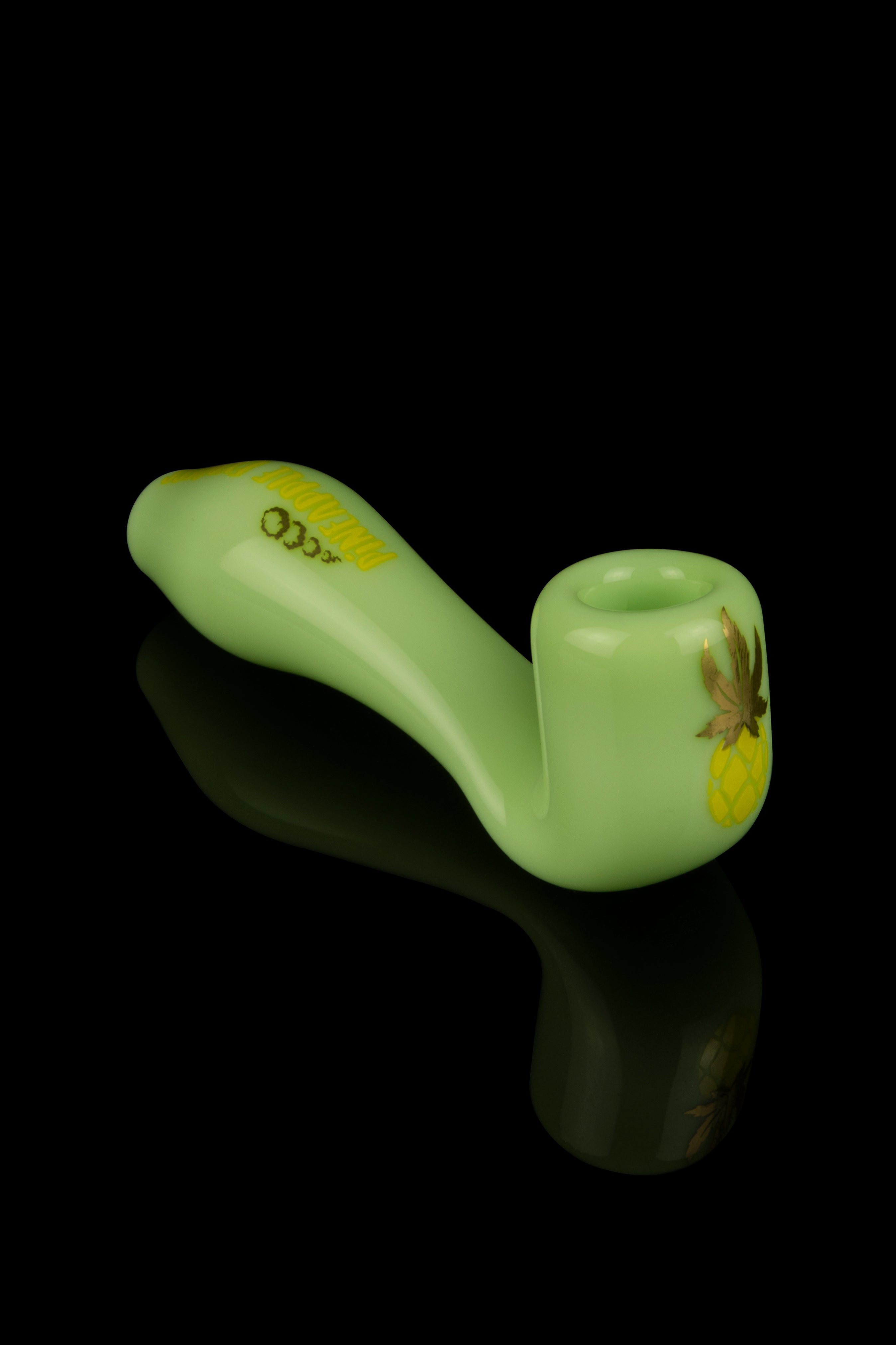 Pale green glass pipe with gold cannabis leaf detailing, studio shot on black.