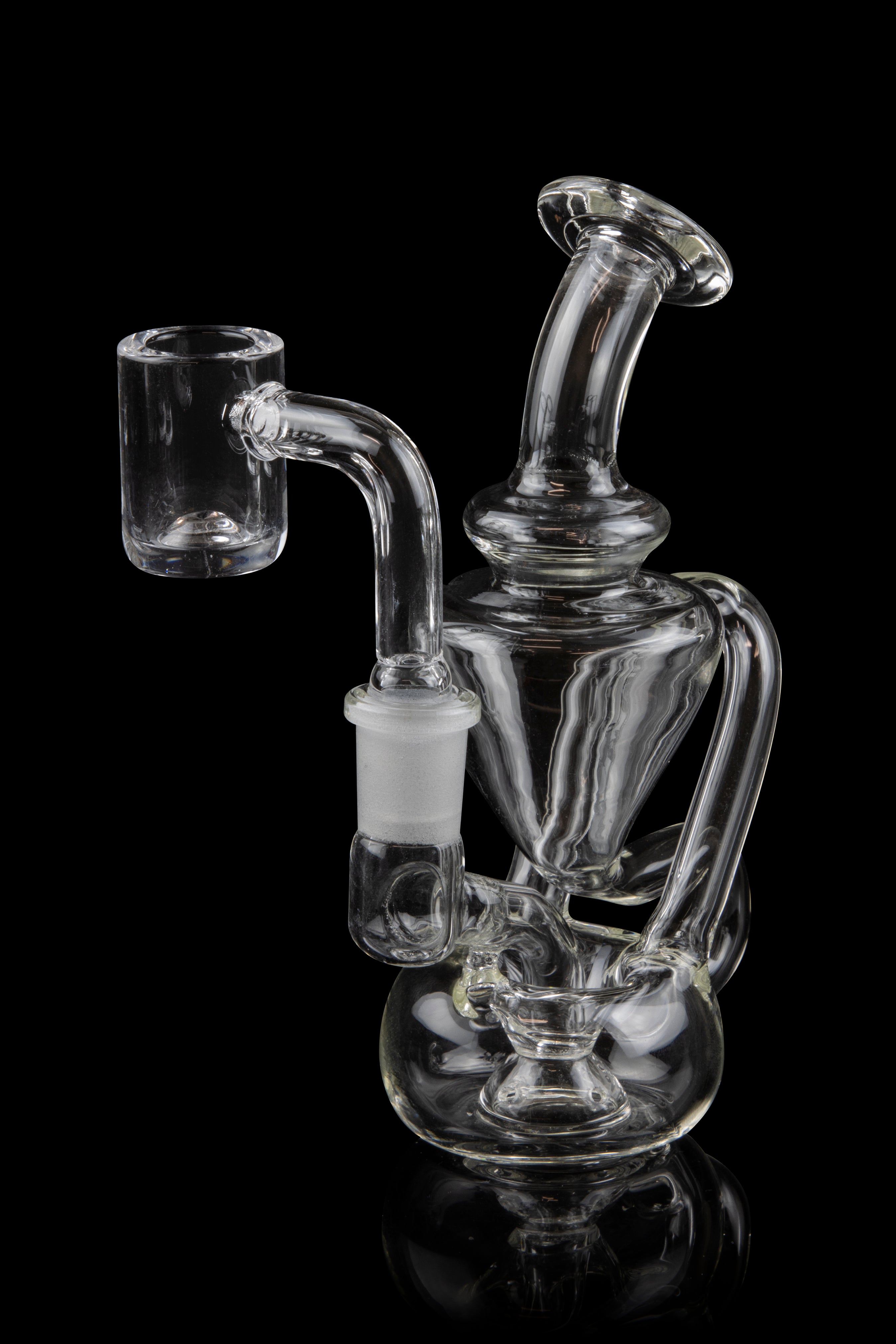 Clear glass dab rig with intricate percolators, isolated on a black background.