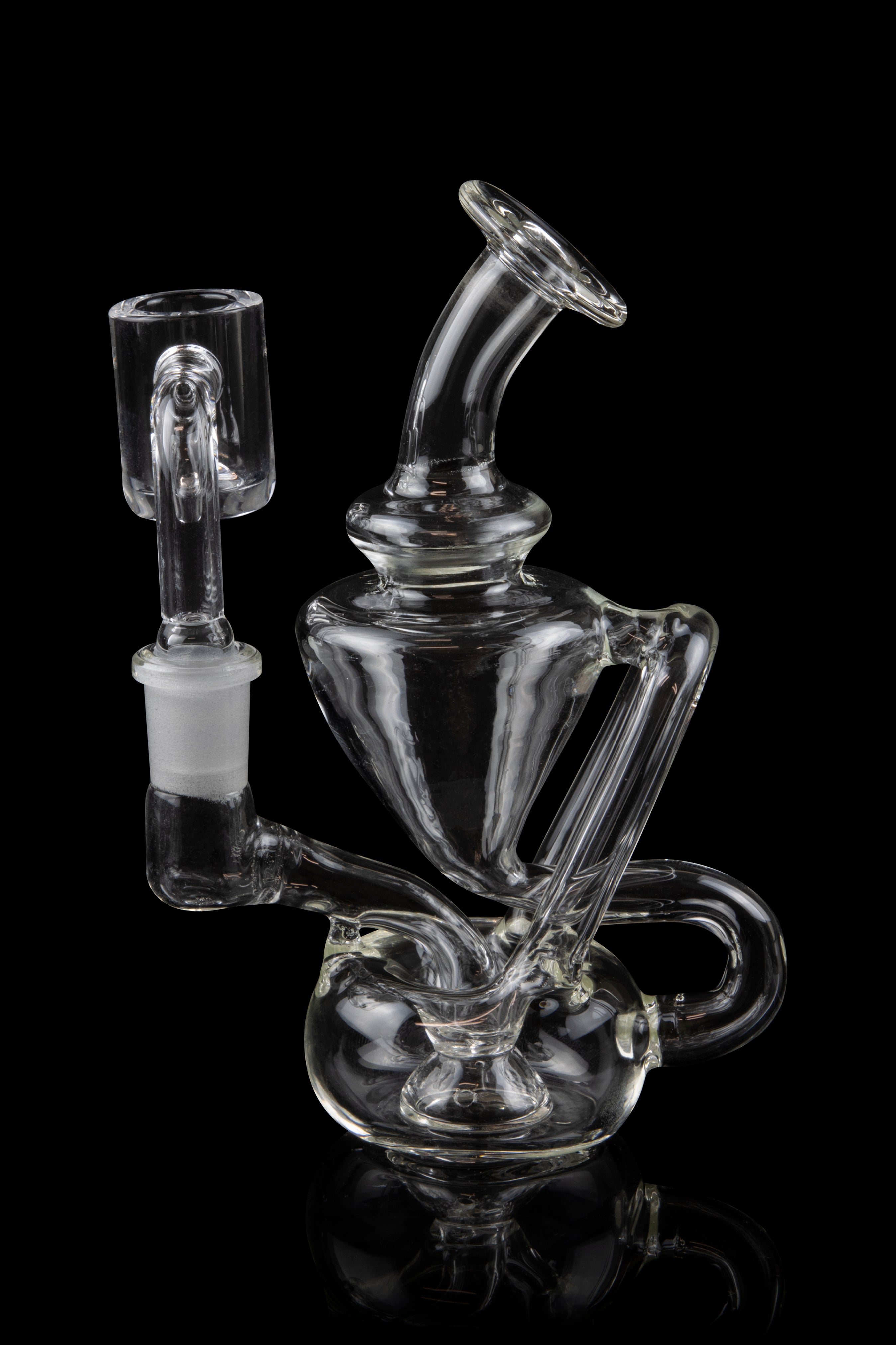 Clear glass water pipe (rig) with intricate bubbler design and separate bowl piece, isolated on black.