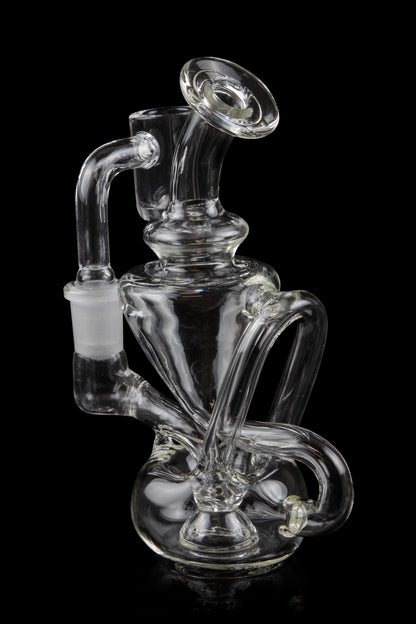 Clear glass water pipe (rig) with intricate swirling design, isolated on a black background.