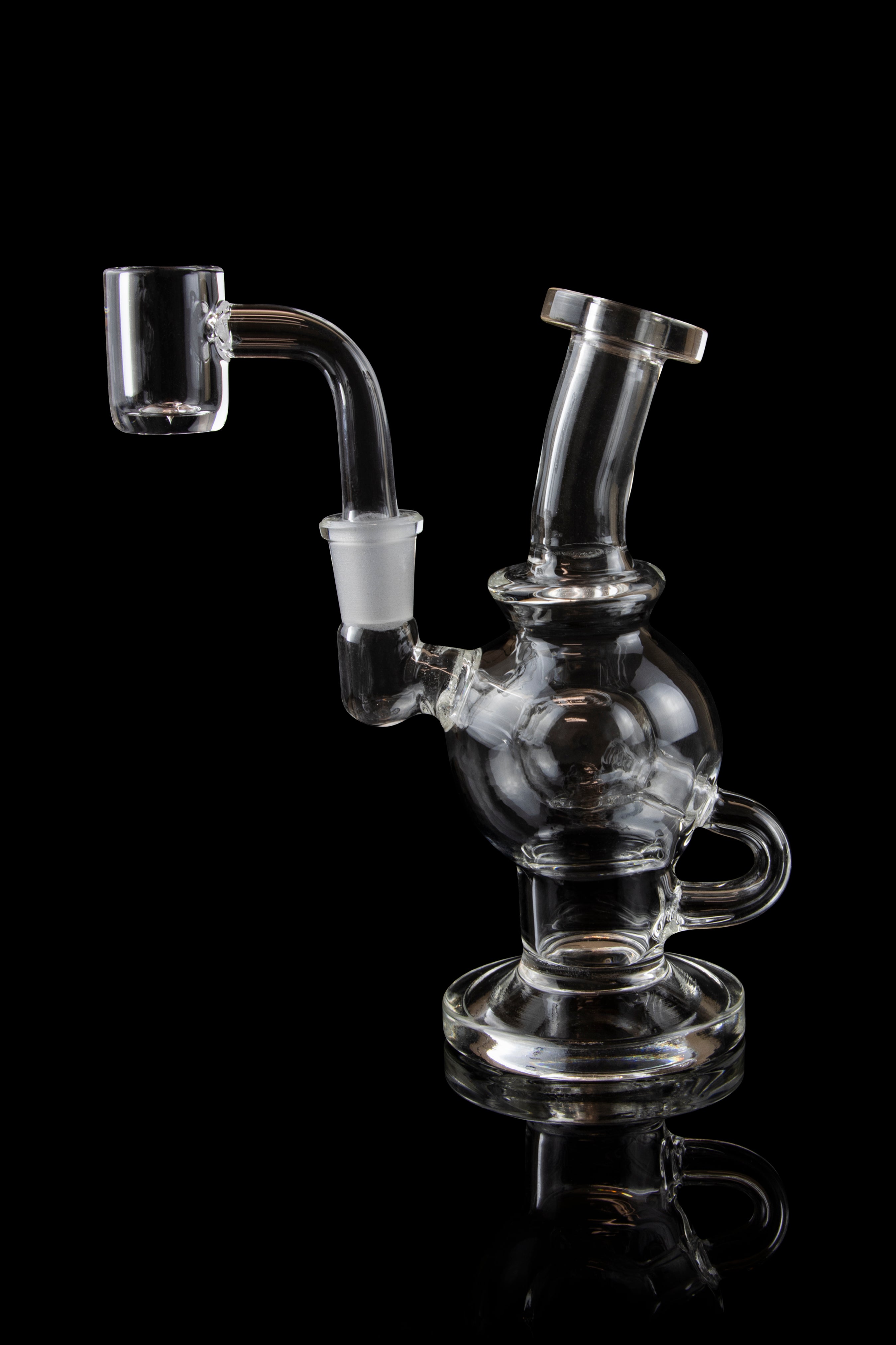 Clear glass dab rig with intricate bubbler design, isolated on a black background.